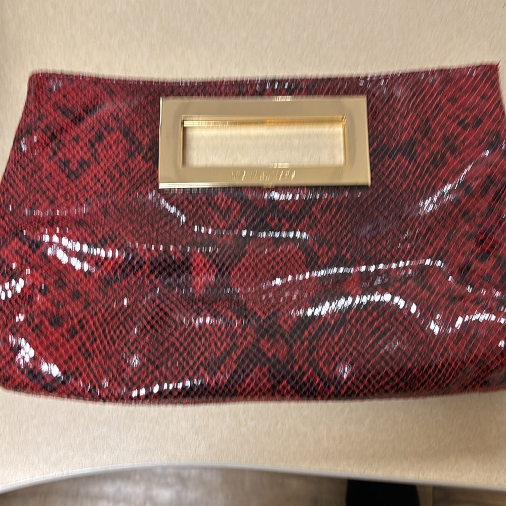 new  authentic Michael Kors clutch 12” x 7 1/2 “ fully lined Michael Kors